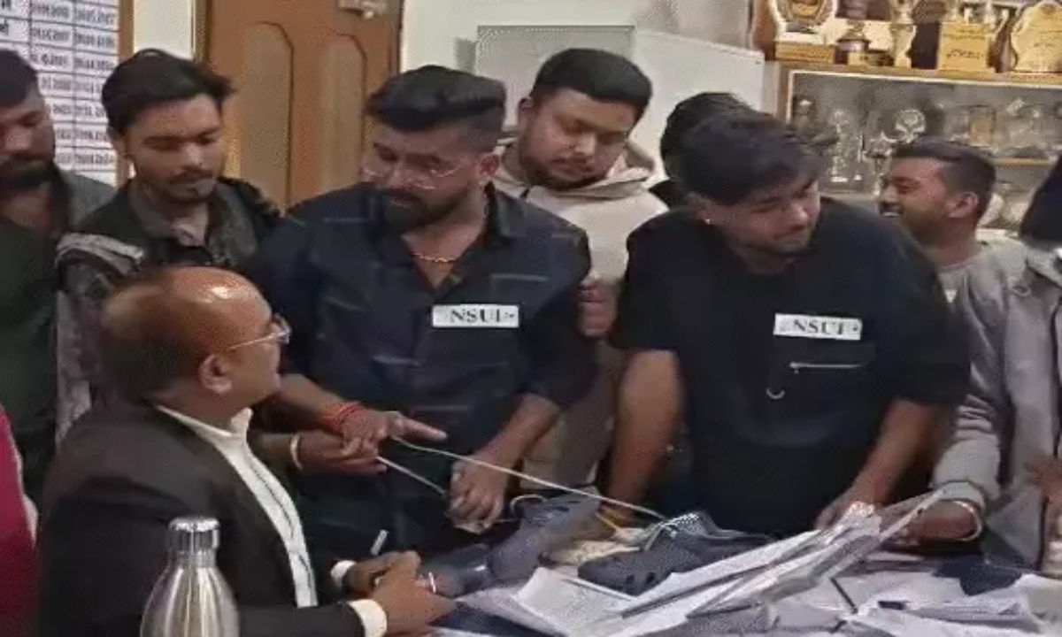 An NSUI leader attempted to garland the principal with shoes; police are searching for him.