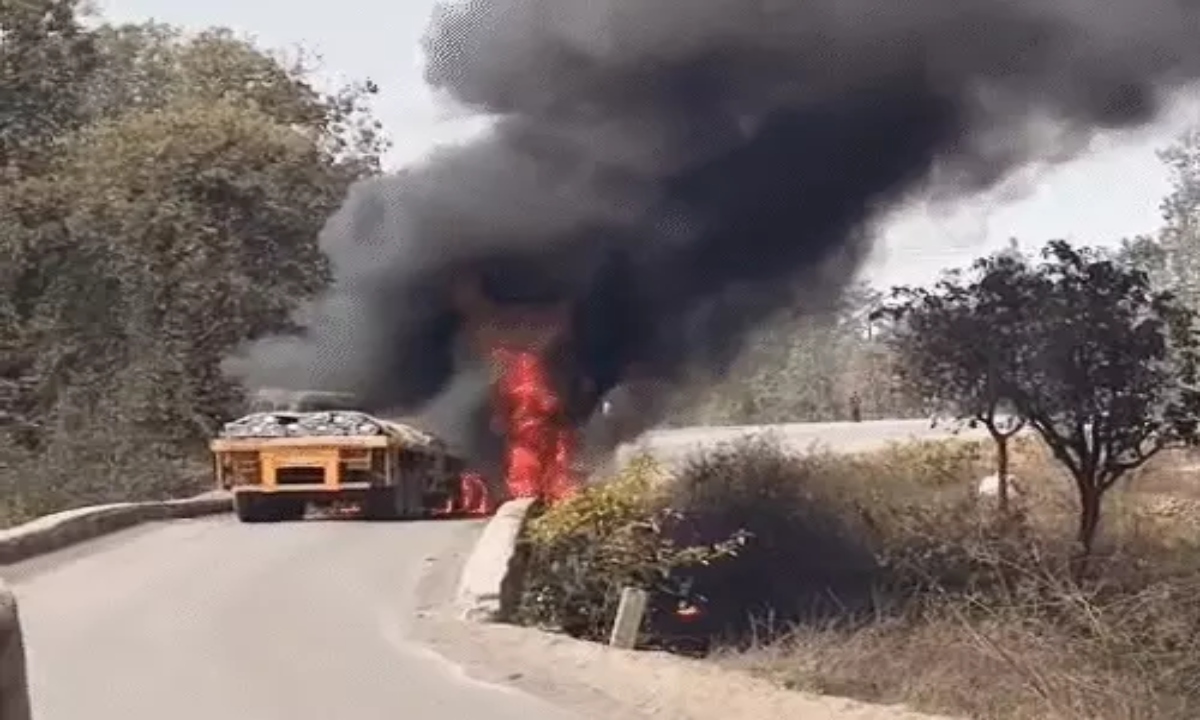 Two trucks collide, driver burns to death