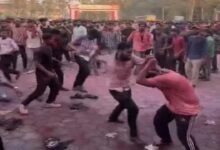 Students exchange blows during Holi celebrations