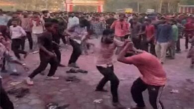 Students exchange blows during Holi celebrations