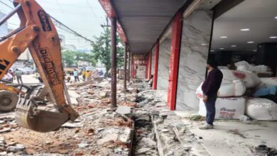 Municipal Corporation's bulldozer targets illegal encroachments in Raipur: Drain covering demolished in front of Prakash Wholesale.