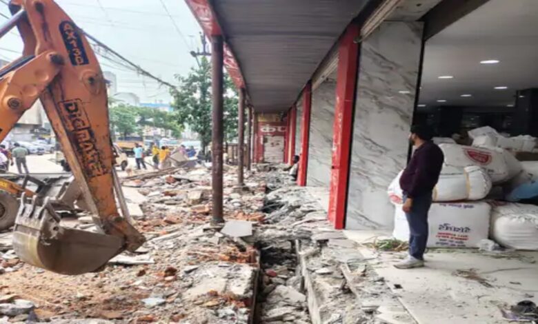 Municipal Corporation's bulldozer targets illegal encroachments in Raipur: Drain covering demolished in front of Prakash Wholesale.