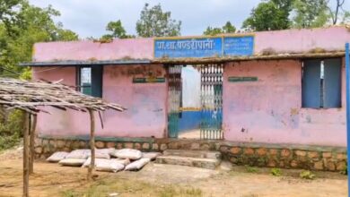 School building incomplete for a year; children forced to study under a thatched roof.