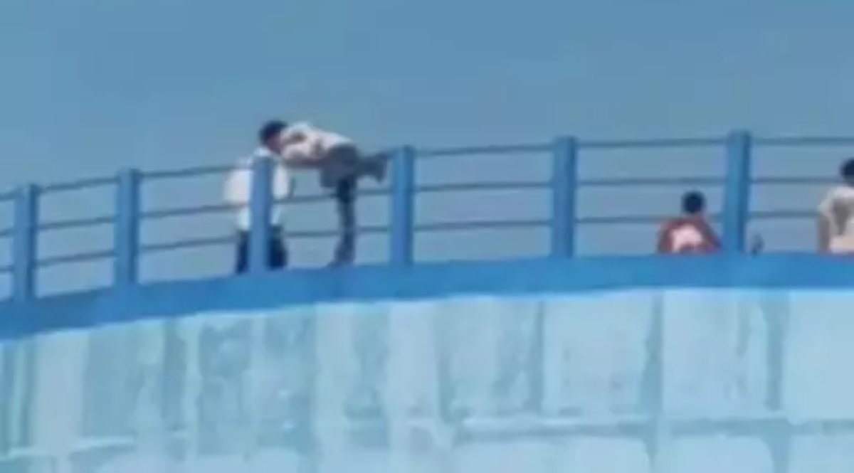 Life-threatening photoshoot on a 70-foot-high water tank.