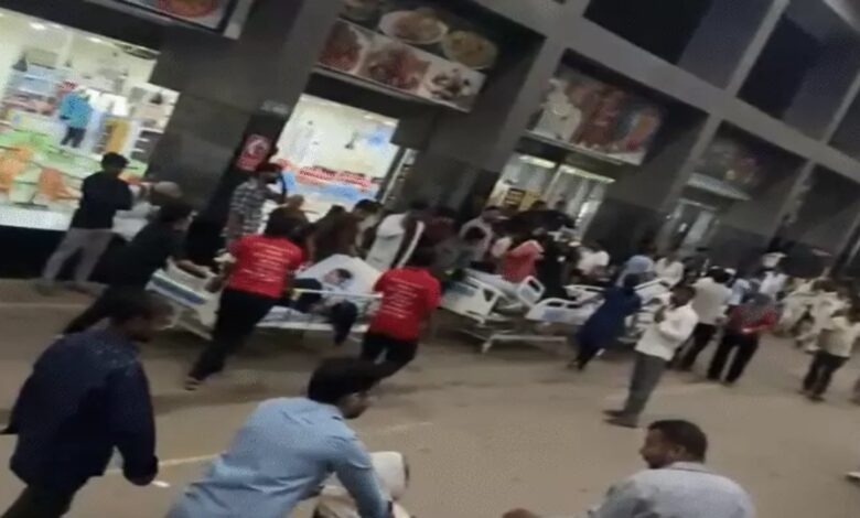 Fire breaks out at hospital: Relatives rush out with patients.