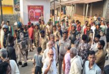Husband shot dead while sleeping in a tea shop; two bullets fired into the eyes of his fleeing wife.