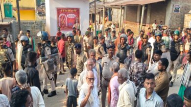 Husband shot dead while sleeping in a tea shop; two bullets fired into the eyes of his fleeing wife.
